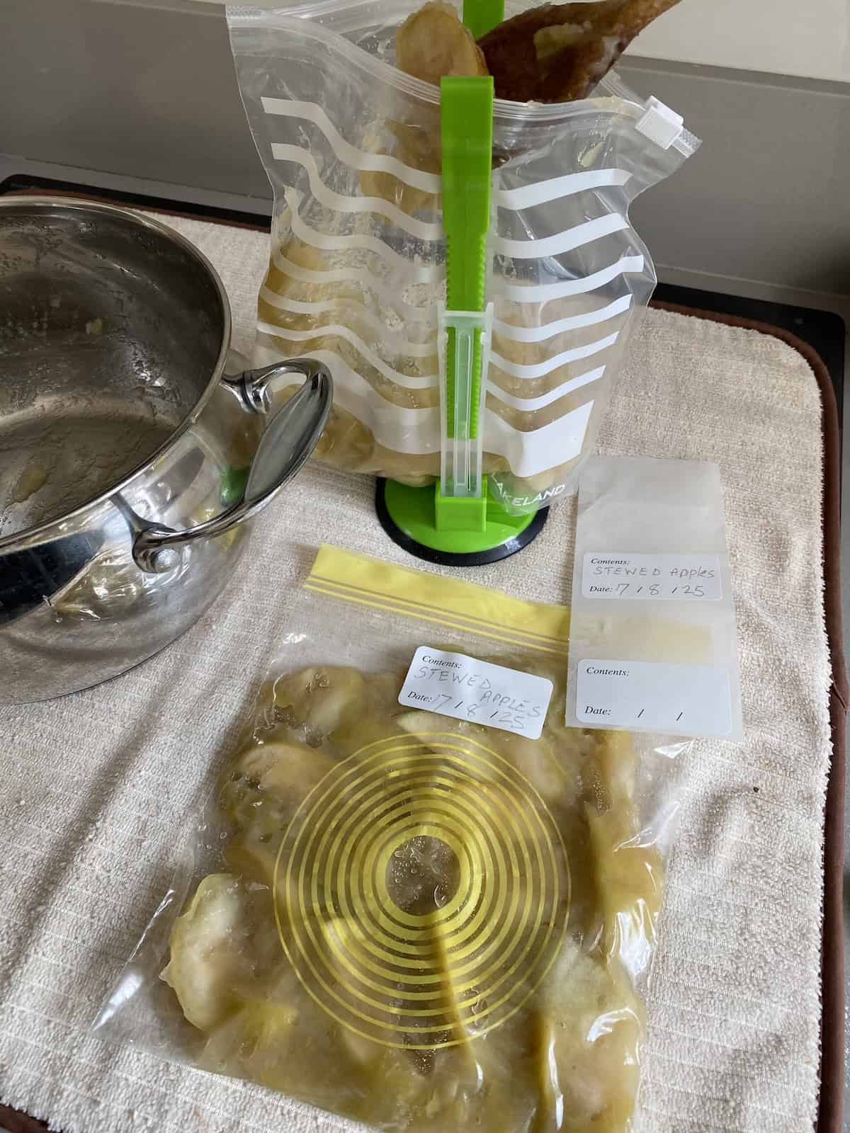 Vacuum-sealed frozen food in a freezer drawer for long-term storage.