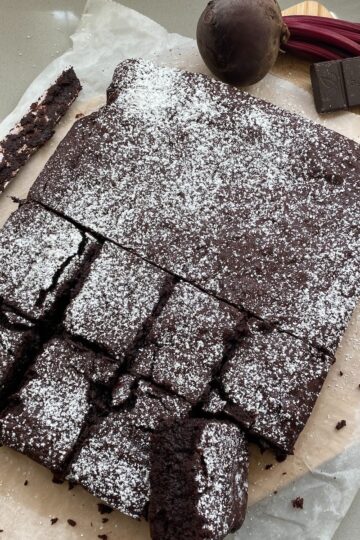 Beetroot and Chocolate brownies with slices cut out.