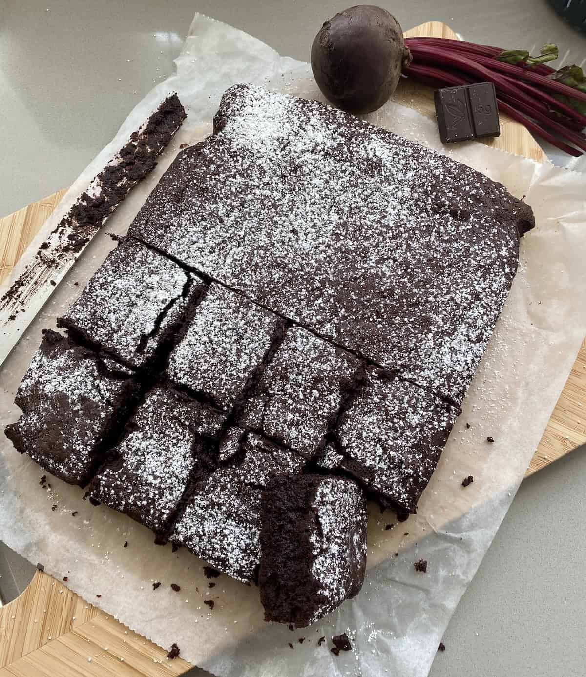 Beetroot and Chocolate brownies with slices cut out.
