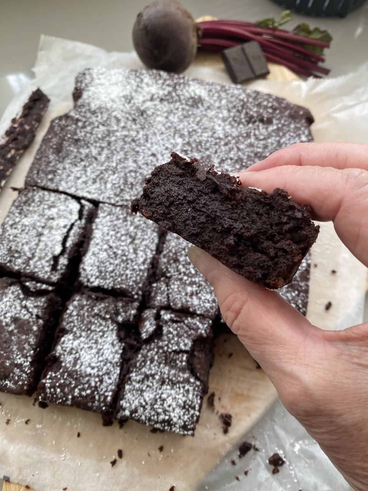 Beetroot and Chocolate brownies with slices cut out.