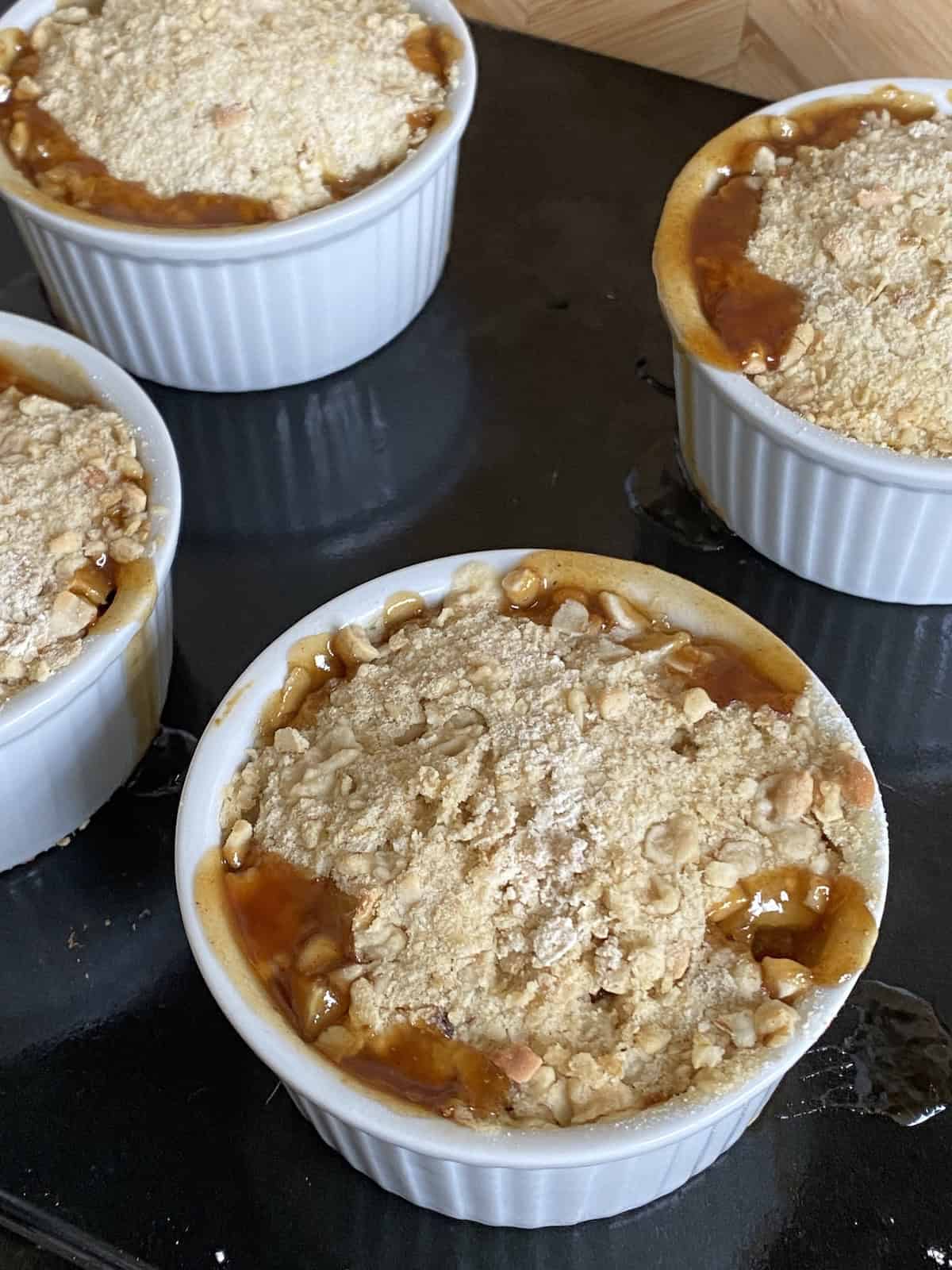 Baked Mincemeat and Pear Crumbles on a baking tray.