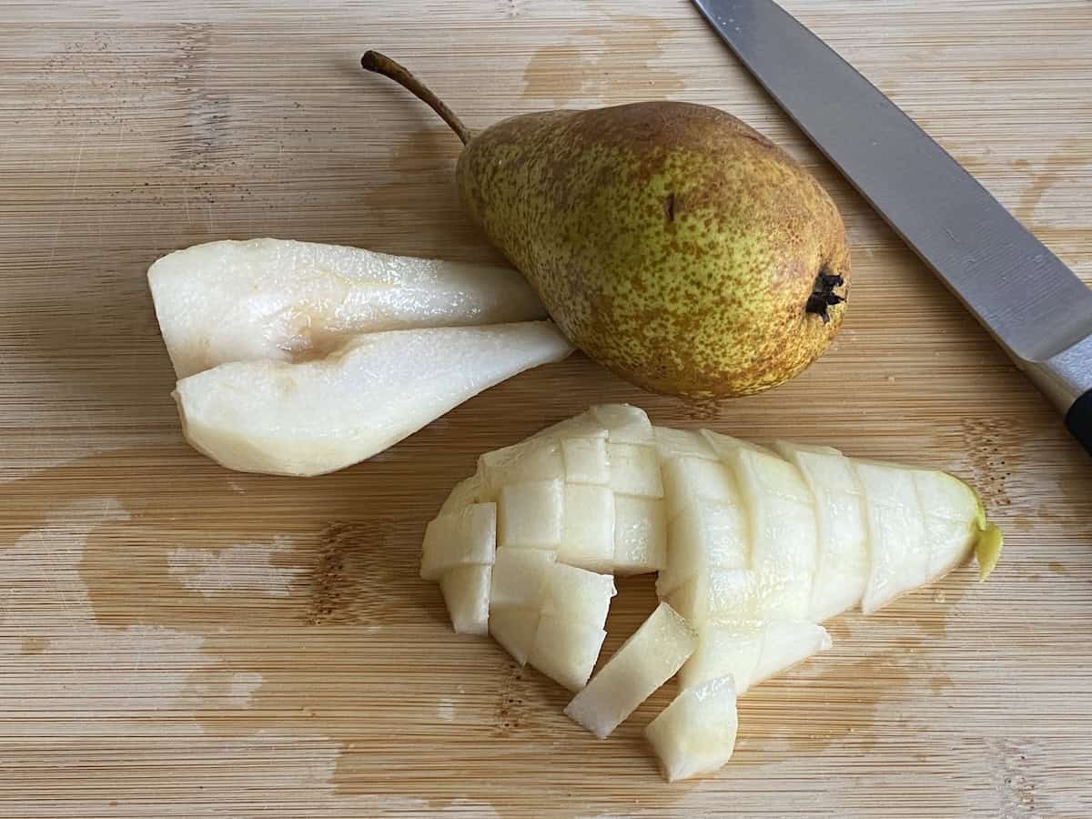 Chopped Pears on a wooden board.