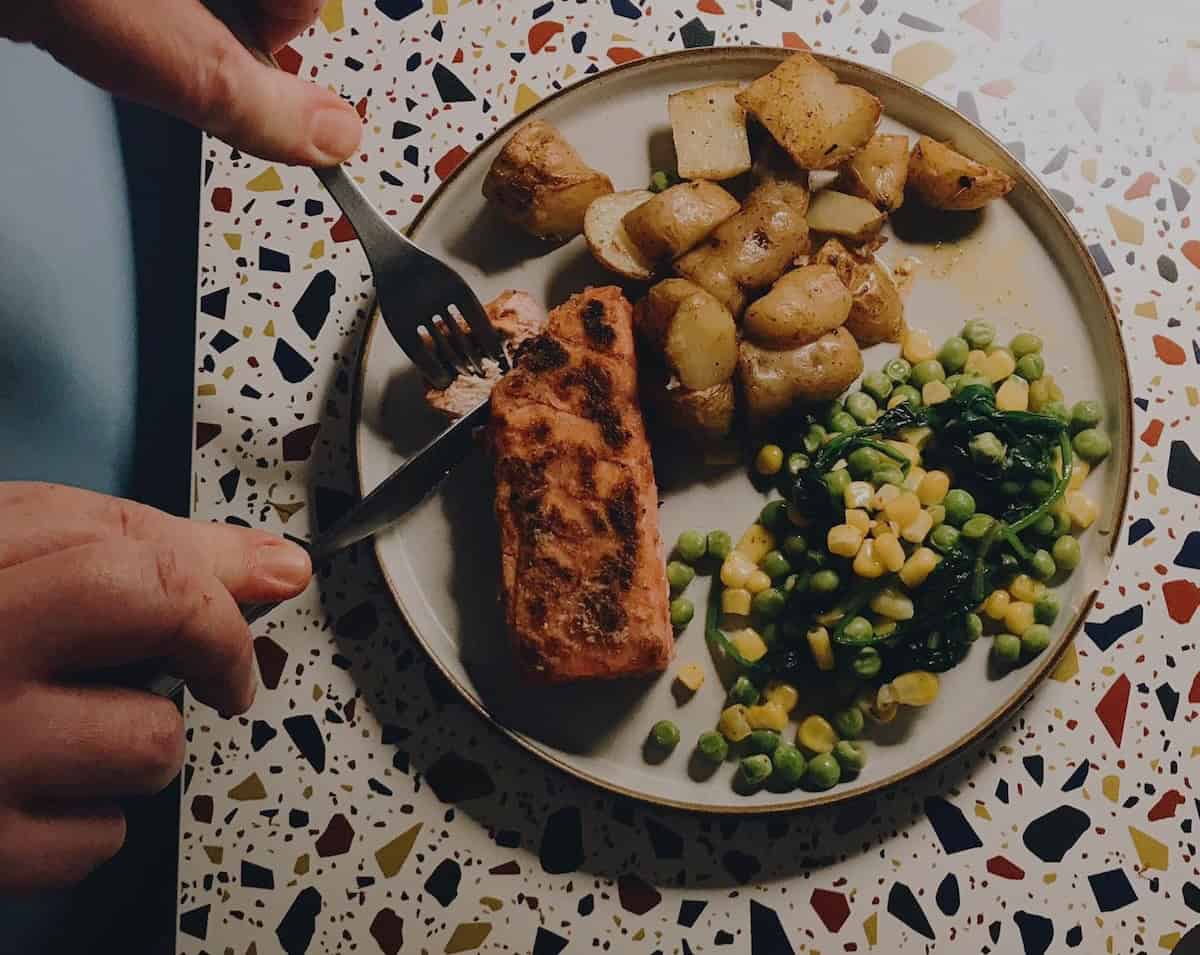 Vegan Salmon served with a selection of vegetables.