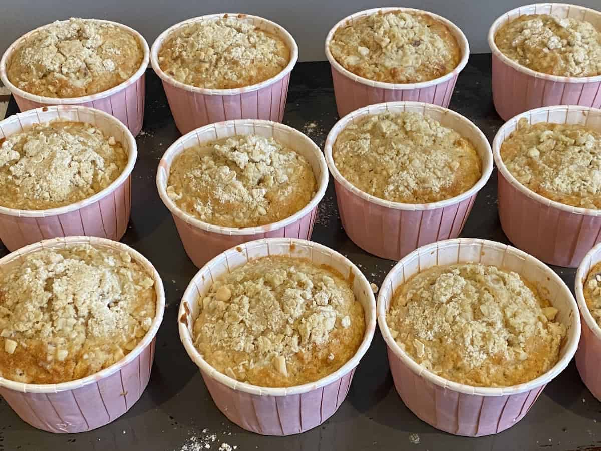 12 Apple, Oat and Cinnamon Muffins on a baking tray.