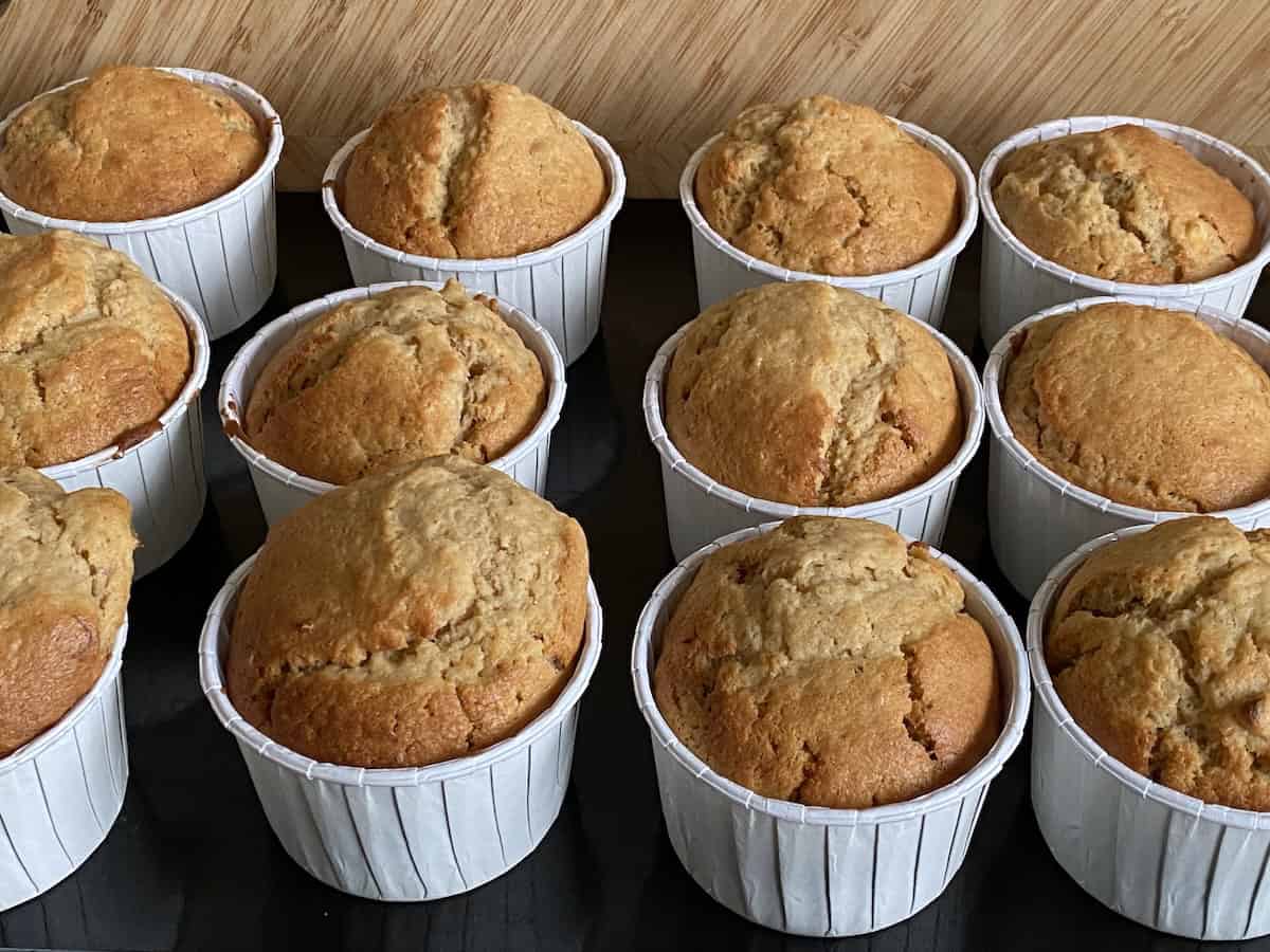 Baked Banana and Peanut Butter Muffins on a baking tray.