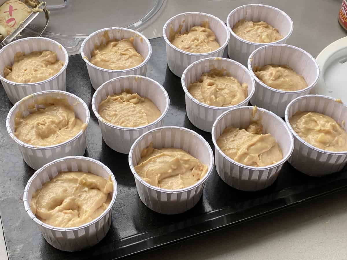 Fill the large muffin cups to ¾ full with peanut butter muffin batter.
