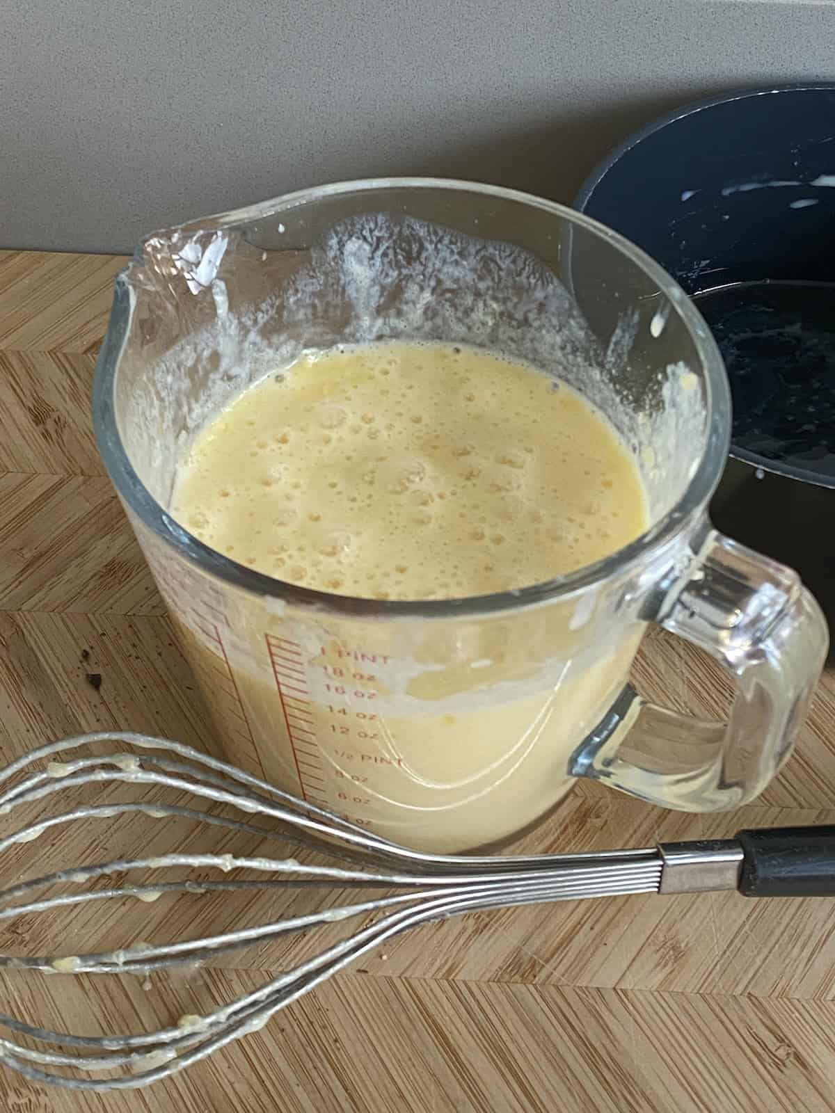 Jug of melted butter, eggs and buttermilk.