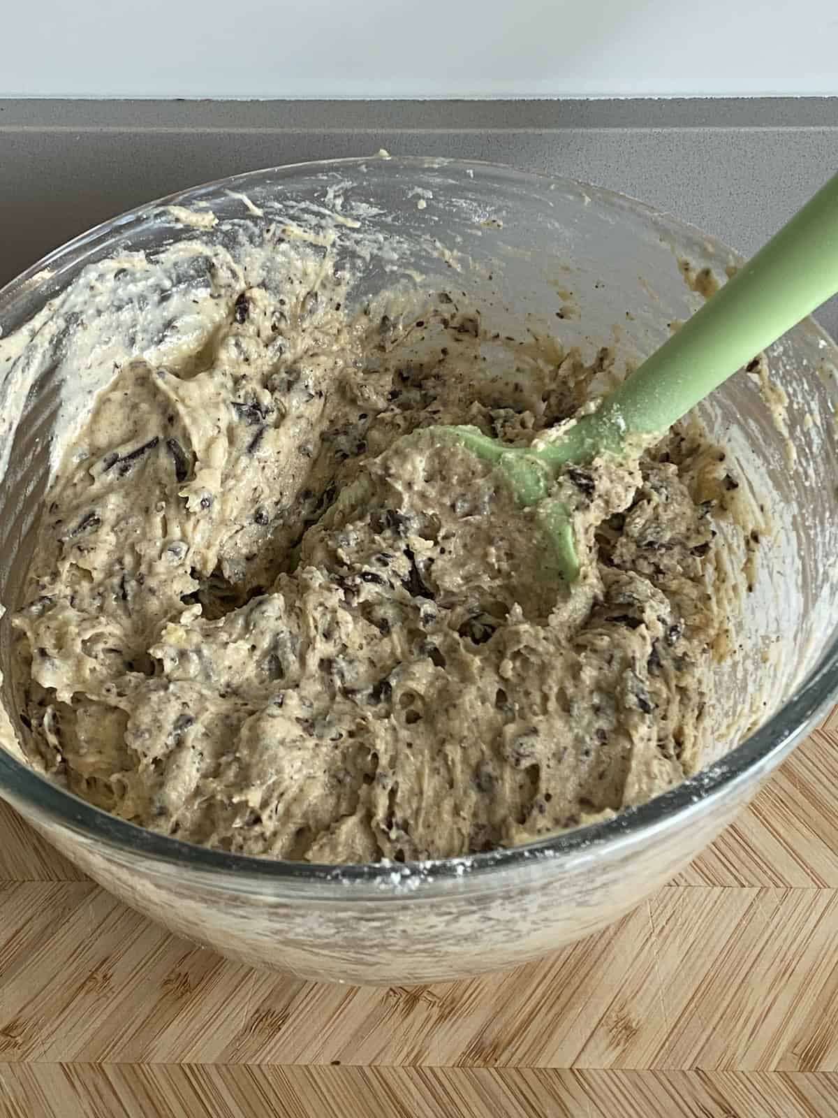 Muffin batter in a glass bowl.