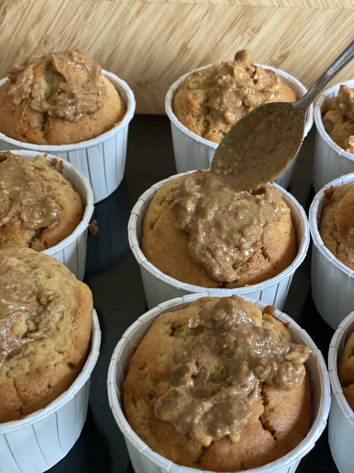 Top Banana and Peanut Butter Muffins with a teaspoon of chunky peanut butter for extra flavour.
