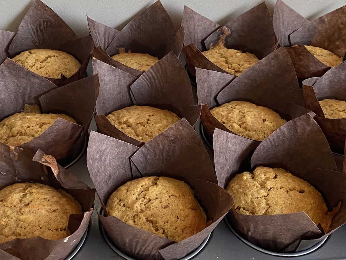 Baked Carrot cake Muffins on a Muffin tray.