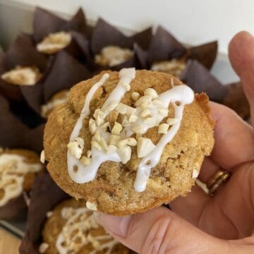 Carrot cake Muffin topped with Icing & nuts.