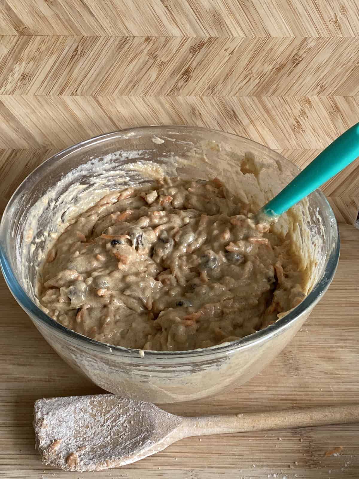 Carrot cake mixture in a glass bowl.