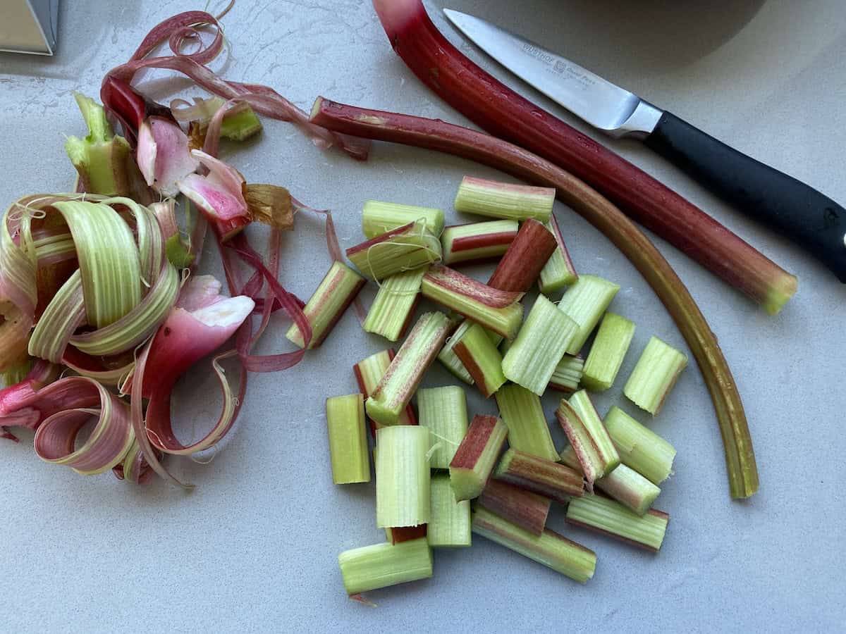 Peeled and chopped Fresh garden rhubarb stalks for traditional British flapjacks.