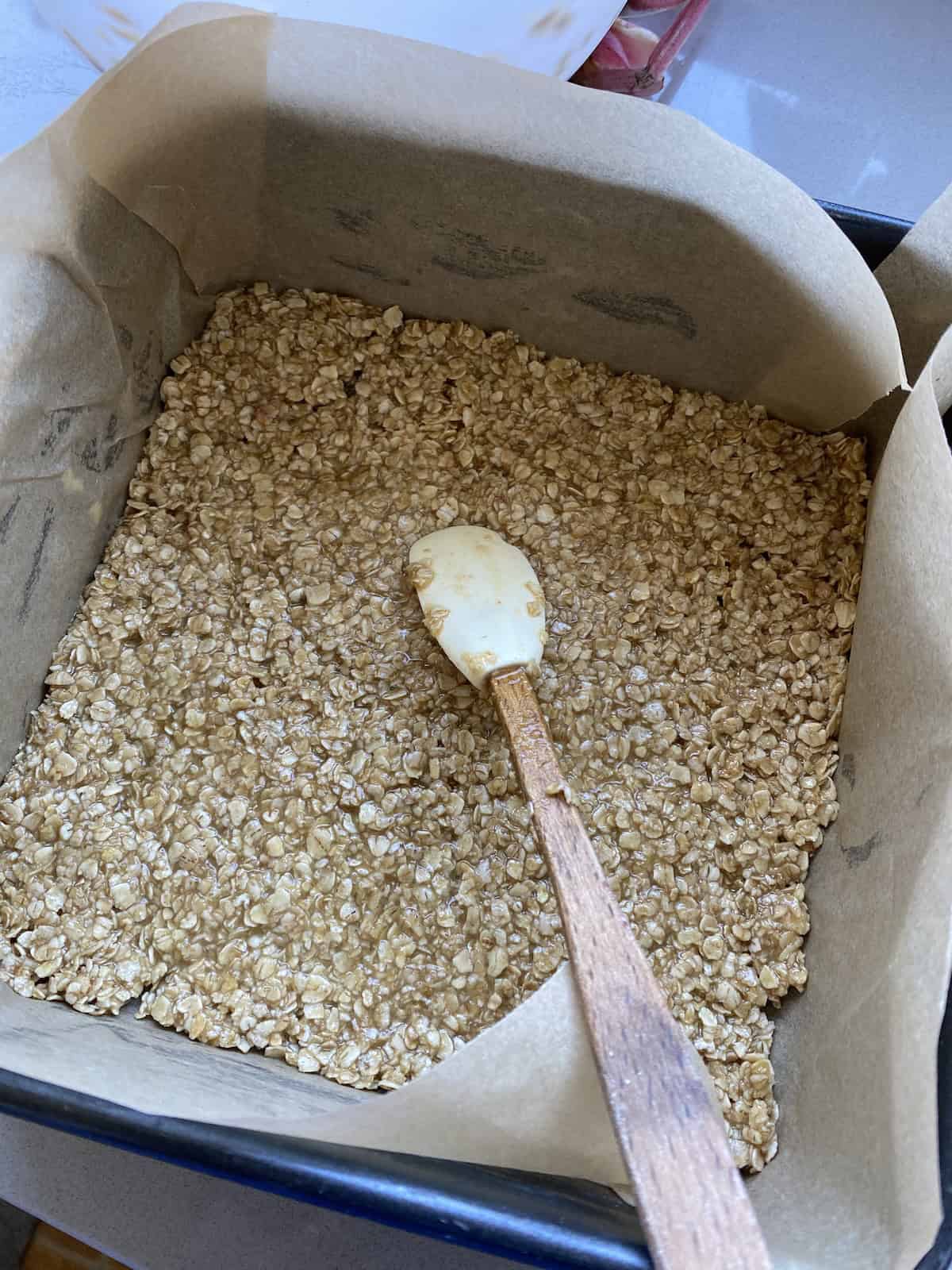 Flapjack mixture in a square tin.