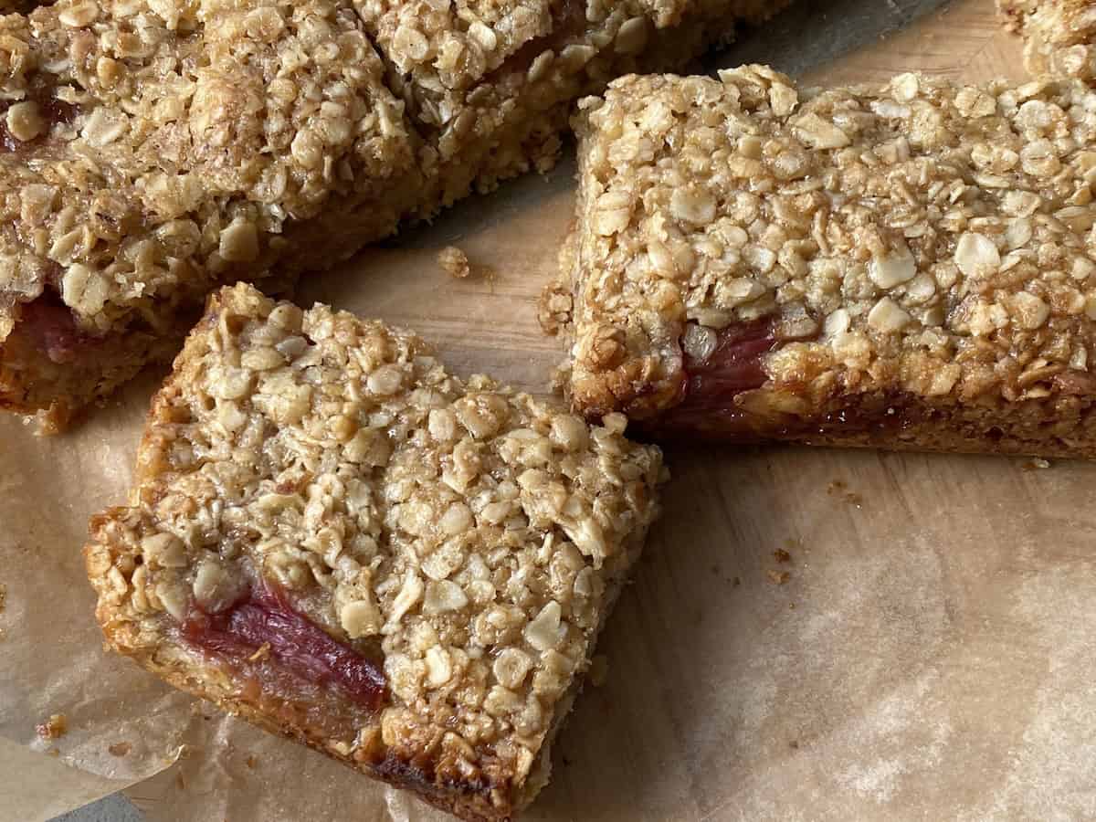Slices of firm non soggy Rhubarb and Ginger Flapjacks.