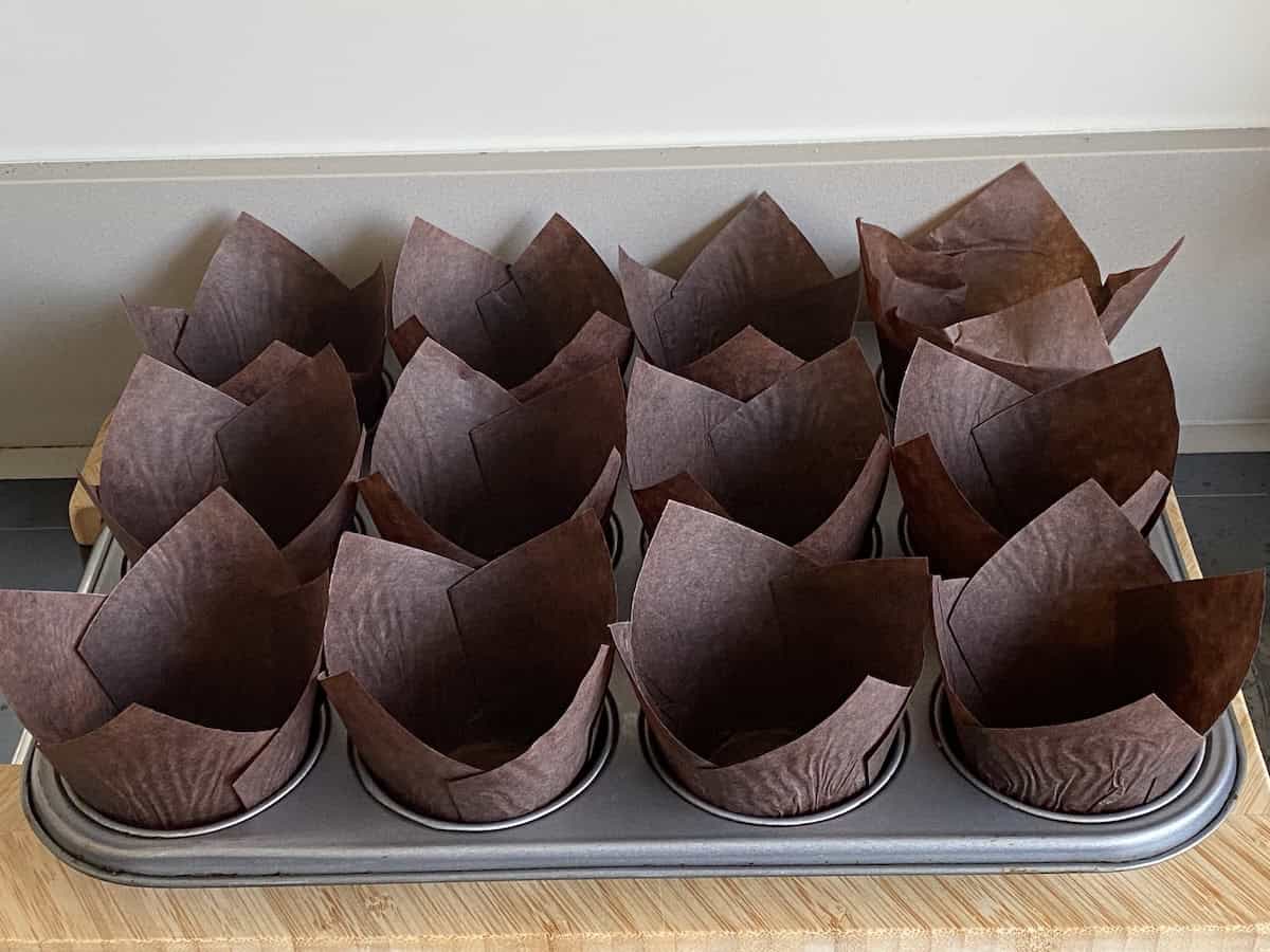 Tulip Paper Muffin Cases in a muffin tray.